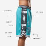 Back view of custom team basketball shorts in teal and black with sublimated waistband and black side panels