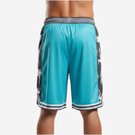 Opposite side view of custom team basketball shorts in teal and black showing side panel design and stripe hem band