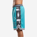 Left side view of teal and black custom basketball shorts with sublimated elastic waistband and V-notch hem split