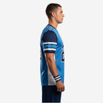 Custom team football jersey in royal blue with navy shoulder panels three-stripe sleeve bands and white side panels worn by male player front view