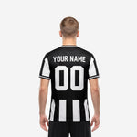 Custom team soccer jersey black and white stripe, back view showing player surname and number print placement on male model