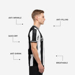 Close detail of crew neckline and sleeve cuff black contrast trim on custom team soccer jersey in black and white stripe
