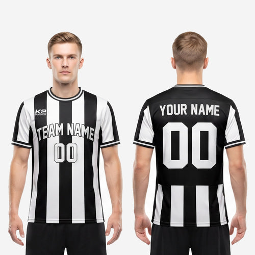 Full body view of custom team soccer jersey in bold black and white vertical stripe with sublimated team name and number on male model