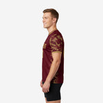 Custom training jerseys for teams with maroon body and athletic gold camo sleeve banding, right side view