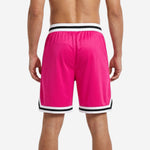 Back view of custom pink and black basketball shorts showing full sublimation, hem trim, and side split detail