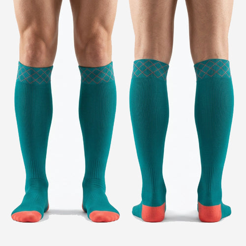 Custom knee-high turquoise soccer socks with teal body and coral heel, sized YS through 3XL for whole-team ordering