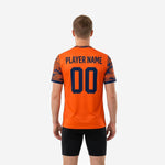 Custom printed practice jersey front detail showing orange body with full-dye sublimated navy camo sleeve panels