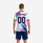 Close-up of custom unique soccer uniforms V-neck collar with navy rib trim and halftone dot-burst print on white jersey