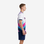 Custom unique soccer uniforms showing diagonal hot pink and sky blue splash pattern on white jersey, left side view