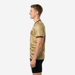 Right side view of Vegas Gold dye sublimated training jersey with chocolate brown contrast V-neck collar trim