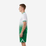 Custom white and Kelly Green soccer uniform set with dot-burst gradient pattern, side view on adult male model