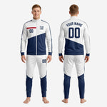 Full custom white and navy blue men's soccer tracksuit set showing jacket and matching pants, complete outfit view