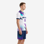 Custom white soccer uniforms side view showing teal and purple diagonal graphic pattern on jersey and dot-burst shorts
