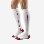 Custom white and red soccer socks angled view showing Dark Red reinforced heel cap and toe cap