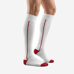 Custom white and red soccer socks side view displaying full-length Dark Red contrast stripe from cuff to toe