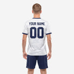 Custom white soccer uniform navy blue kit front detail showing sublimated camo pattern and team name print
