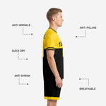 Custom yellow soccer uniform shorts detail showing jet black body with yellow hem band and player number on left leg