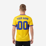 Custom yellow soccer jersey back view showing player surname and back number in Royal Blue on yellow body