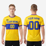 Close-up of sleeve cuff on custom yellow soccer jersey showing Royal Blue and Crimson stripe trim detail