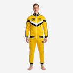 Men's custom yellow soccer tracksuit with black and white chevron chest panel, full-zip jacket and tapered pants, front view