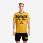 Custom yellow soccer uniform in Athletic Gold and black with geometric chest band, crew neck, and matching black shorts with gold chevron panels - front view