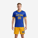 Custom yellow soccer uniform in Royal Blue and Athletic Gold, front view showing team name and number on jersey with matching gold shorts