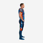 Blue and orange custom American football uniform side view showing orange shoulder panel, sleeve cuff trim, and angular orange-and-white diagonal pant stripe