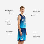 Back view of custom youth basketball uniform set in navy and cyan showing back number placement and shorts waistband detail