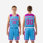 Detail view of custom blue and purple youth basketball shorts showing white hem chevron split and purple side panel