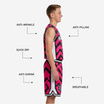 Back view of custom pink and black youth basketball jersey and shorts showing player name lettering, back number placement, and full chevron sublimation across both pieces
