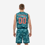 Back view of teal digital camouflage custom youth basketball uniforms showing player name and number placement on jersey and shorts waistband detail