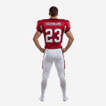 Back view of custom football jersey and pants set in red and white with black trim showing back number and nameplate area