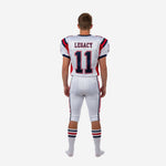 Opposite side view of white red and navy youth football uniform showing set-in sleeve construction, jersey side panel, and pant stripe detail at mid-shin game length