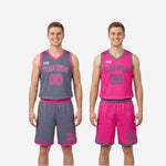 Back view of pink side custom youth reversible basketball uniform showing grey number on back and matching shorts with grey trim hem
