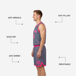 Side view of pink reverse custom youth reversible basketball uniform showing grey bound armhole and shorts hem trim detail