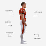 Close detail of sublimated orange football jersey showing black V-neck collar trim, arched team name, and large front number 23 with black outline
