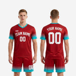 Dark red to teal gradient close-up on custom red soccer uniform showing edge-to-edge sublimation print quality