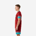 Dark red and teal sublimated red soccer uniform right side view displaying gradient print coverage on jersey and shorts