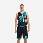 Custom reversible basketball uniform sets in black and teal with diagonal stripe and halftone dot fade, V-neck jersey and matching reversible shorts, front view