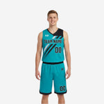 Teal side of custom reversible basketball uniform sets showing teal base jersey with black diagonal stripe, black shoulder panel, and teal shorts with black trim, front view