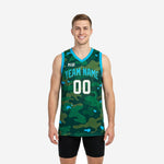 Digital camo basketball jerseys in full-body green camo pattern with teal V-neck and armhole binding, team name and number on front