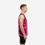 Front view of men's custom digital camo basketball jerseys in pink and maroon with black-outlined block number and arched team name on chest