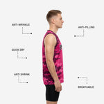 Right side view of custom camo basketball jerseys in hot pink and dark maroon pixel pattern showing full side panel and jersey length on adult male