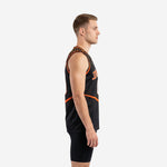 Men's black and orange basketball jersey with orange dot cluster design, V-neck binding, and bold white front number on a male model