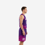 Custom dye sublimation basketball uniform purple and pink splash gradient front view with arced team name and number 00 on chest