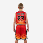 Back view of red and black custom kids basketball uniforms showing back player name and number print zones on the sublimated jersey