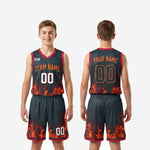 Detail view of flame-pattern basketball shorts showing white player number red hem band and elastic drawcord waistband