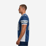 Side view of navy blue custom American football jersey showing white vertical side panel and three-stripe sleeve detail