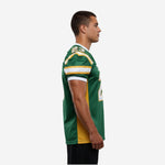 Side view of green and gold sublimated American football jersey showing gold side panel and stripe sleeve bands