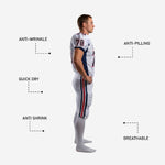 Back view of custom football uniform for clubs in white and navy with back number and matching sublimated pants